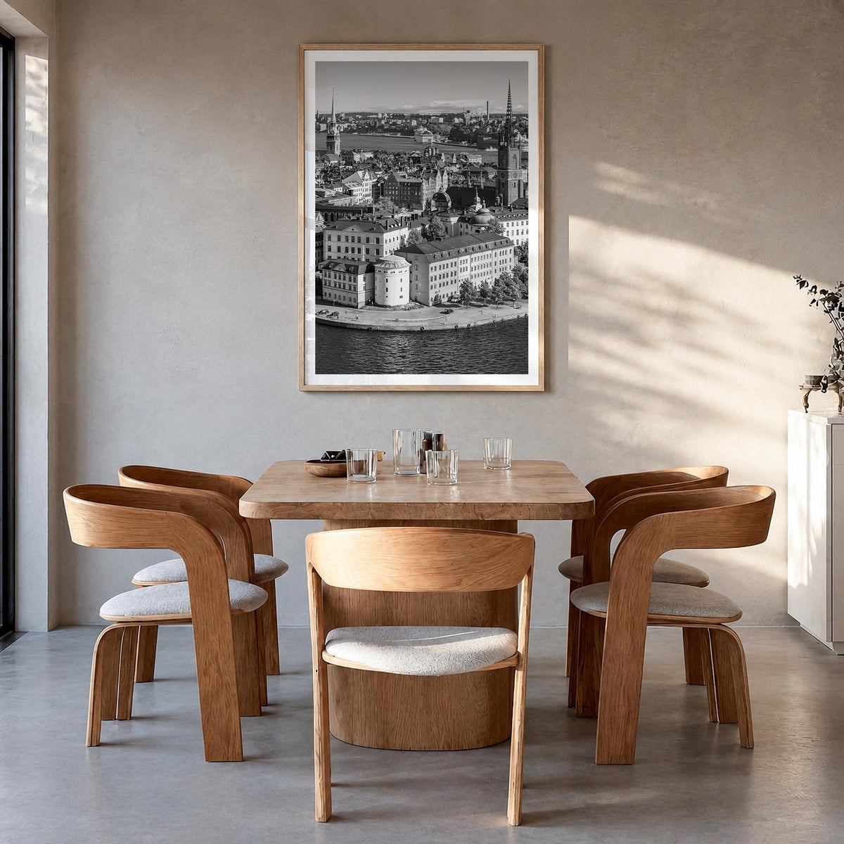 Stockholm black & white photo poster of Sweden – vertical wall art in natural wood frame with white border, hanging on wall