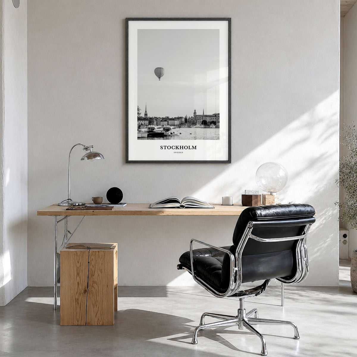 Stockholm Classic No 1 Poster in a black wood frame, hanging in a bright home office