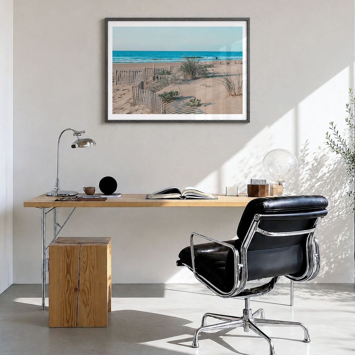 Stone Harbor Photo Poster in a black wood frame, hanging in a bright home office, white border