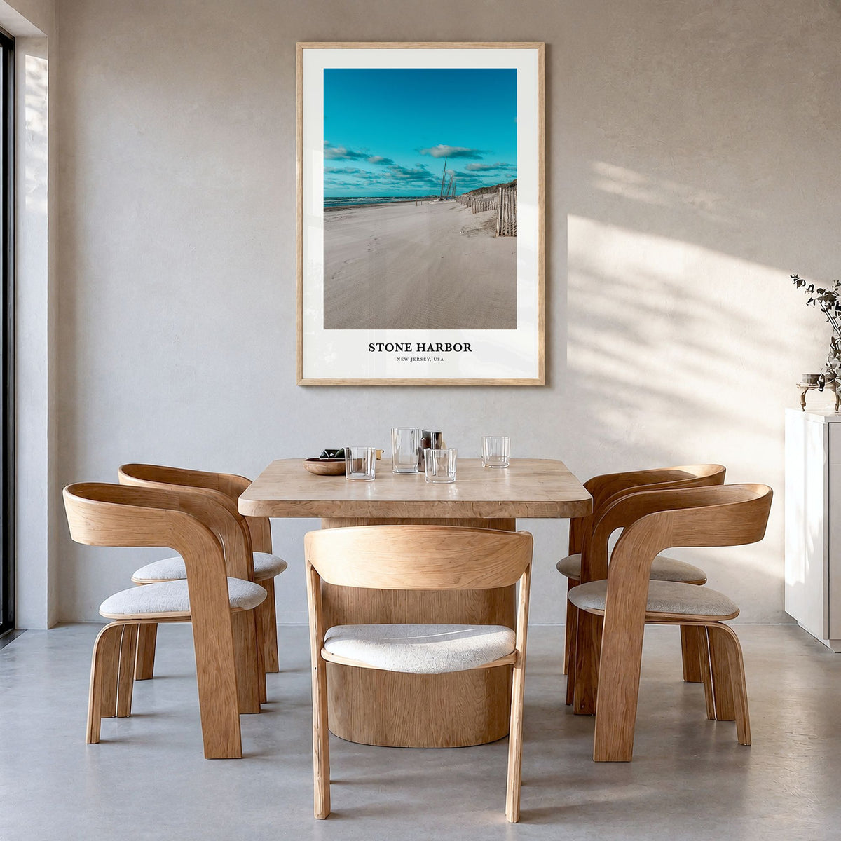 Stone Harbor Classic Poster in a natural wood frame, hanging in a dining room