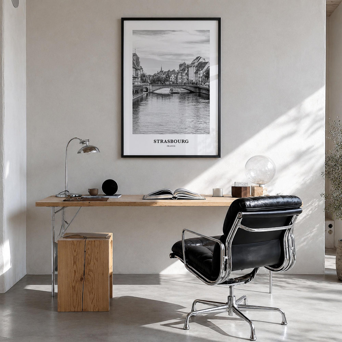 Strasbourg black & white classic poster of France – vertical wall art in black wood frame, hanging on wall
