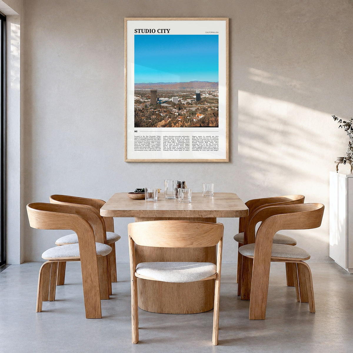 Studio City Travel Poster in a natural wood frame, hanging in a dining room