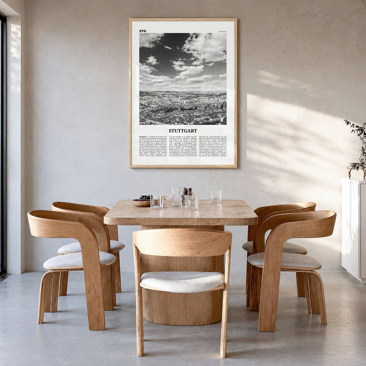 Stuttgart Newspaper Poster in a natural wood frame, hanging in a dining room