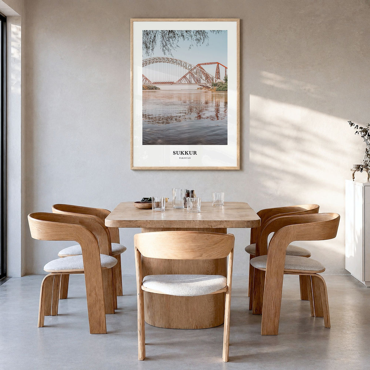 Sukkur Classic Poster in a natural wood frame, hanging in a dining room