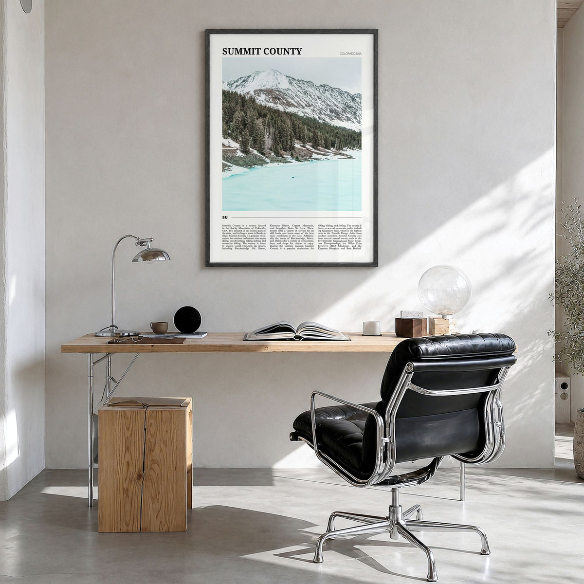 Summit County Travel Poster in a black wood frame, hanging in a bright home office