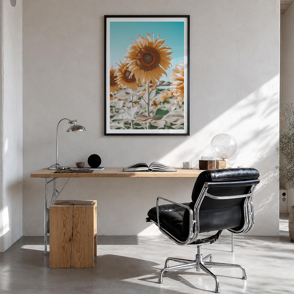 Sunflower Blue Sky colorful photo poster – vertical wall art in black wood frame with white border, hanging on wall