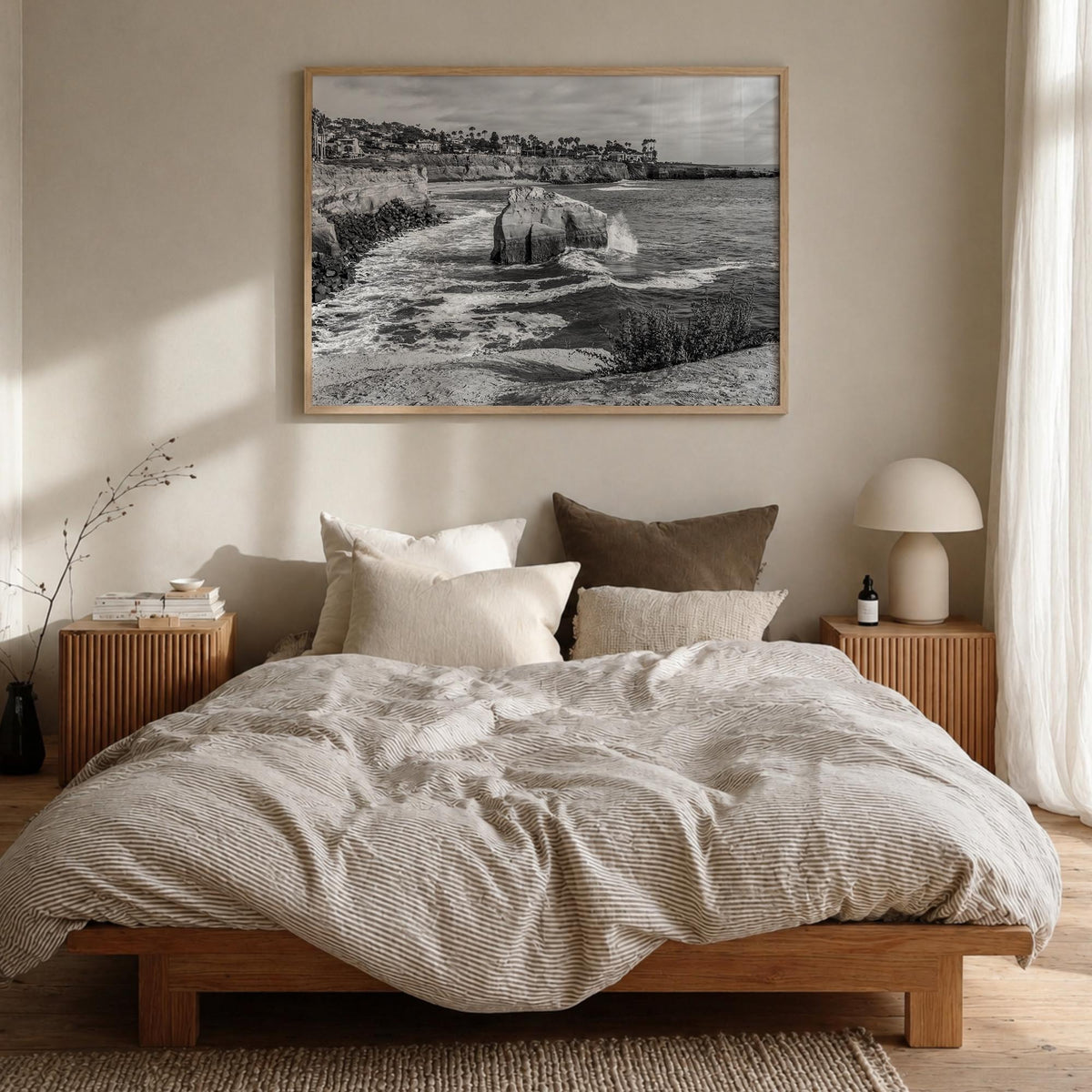 Sunset Cliffs black & white photo poster of San Diego, California – horizontal wall art in natural wood frame, hanging on wal