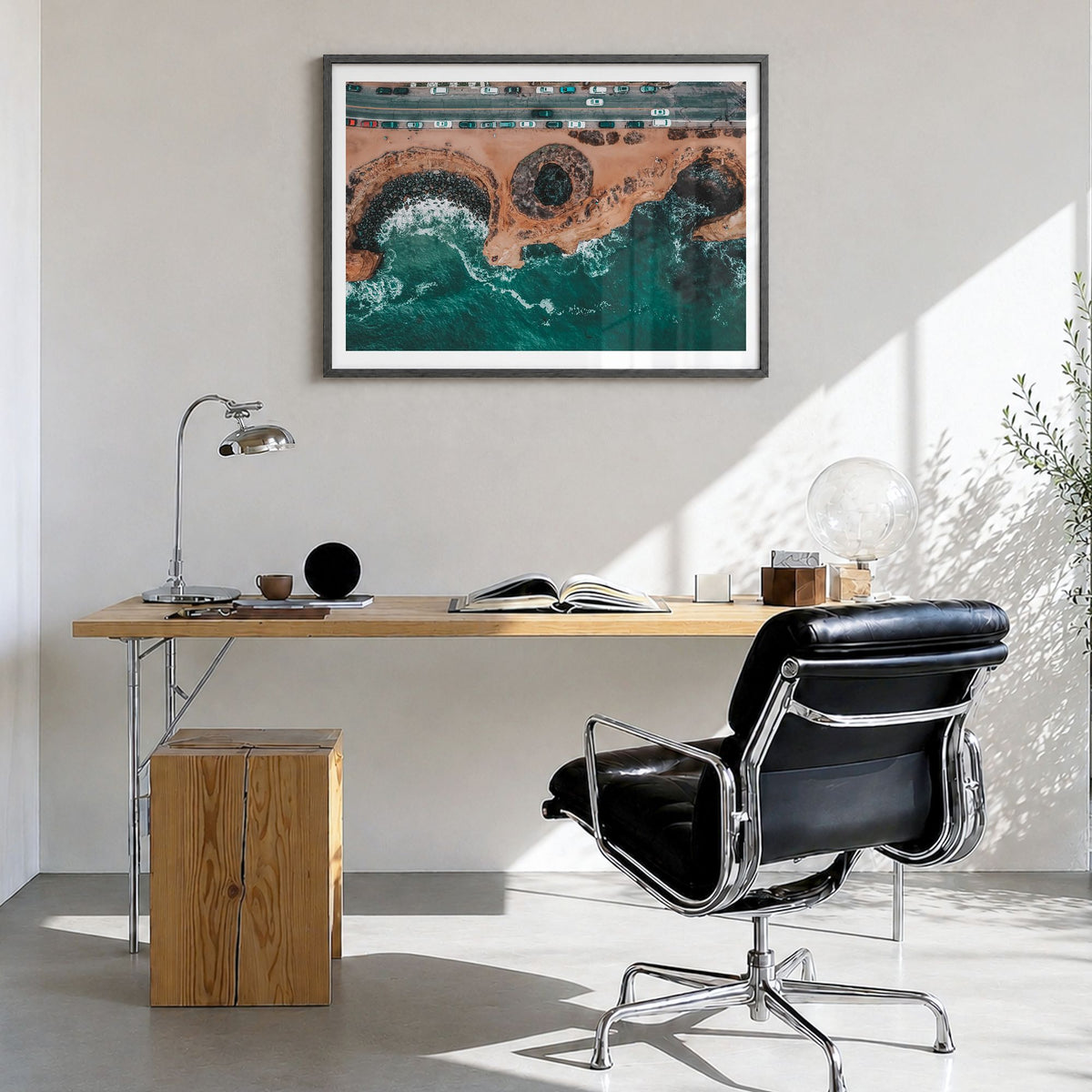 Sunset Cliffs Photo Poster in a black wood frame, hanging in a bright home office, white border