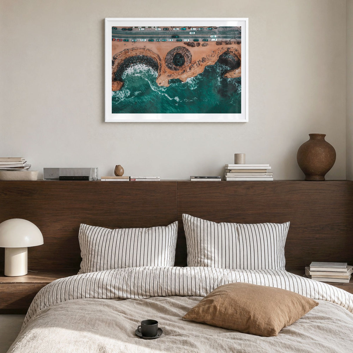 Sunset Cliffs Photo Poster in a white wood frame, hanging in a bedroom, white border