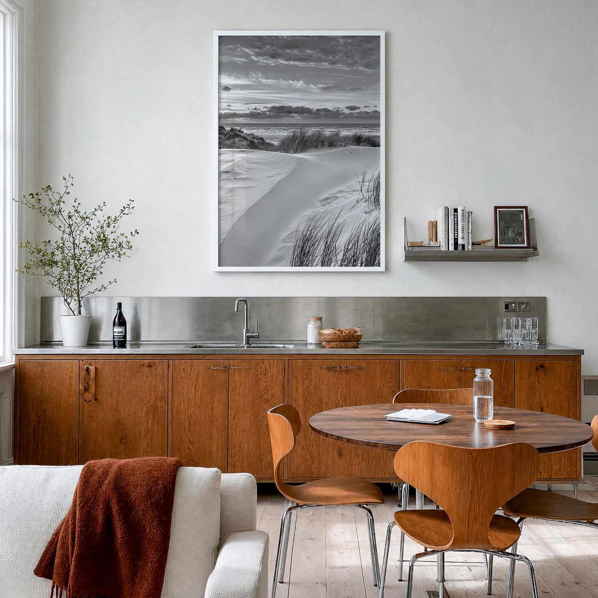 Sunset Coast black & white photo poster – vertical wall art in white wood frame, hanging on wall