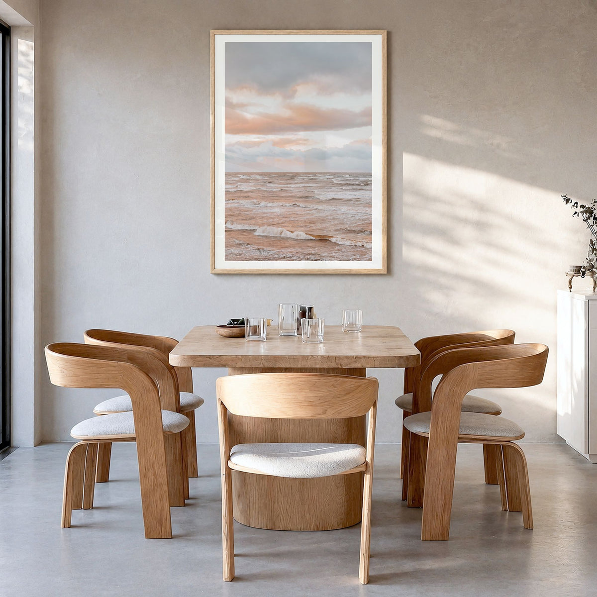 Sunset Waves Photo No 1 Poster in a natural wood frame, hanging in a dining room, white border