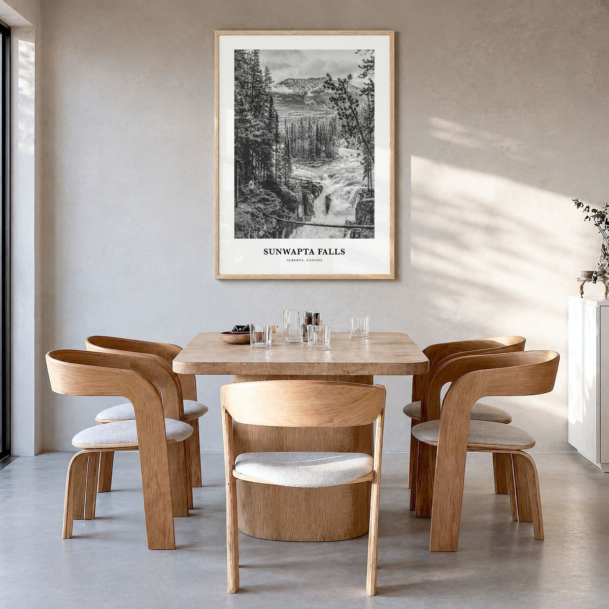 Sunwapta Falls Classic Poster in a natural wood frame, hanging in a dining room