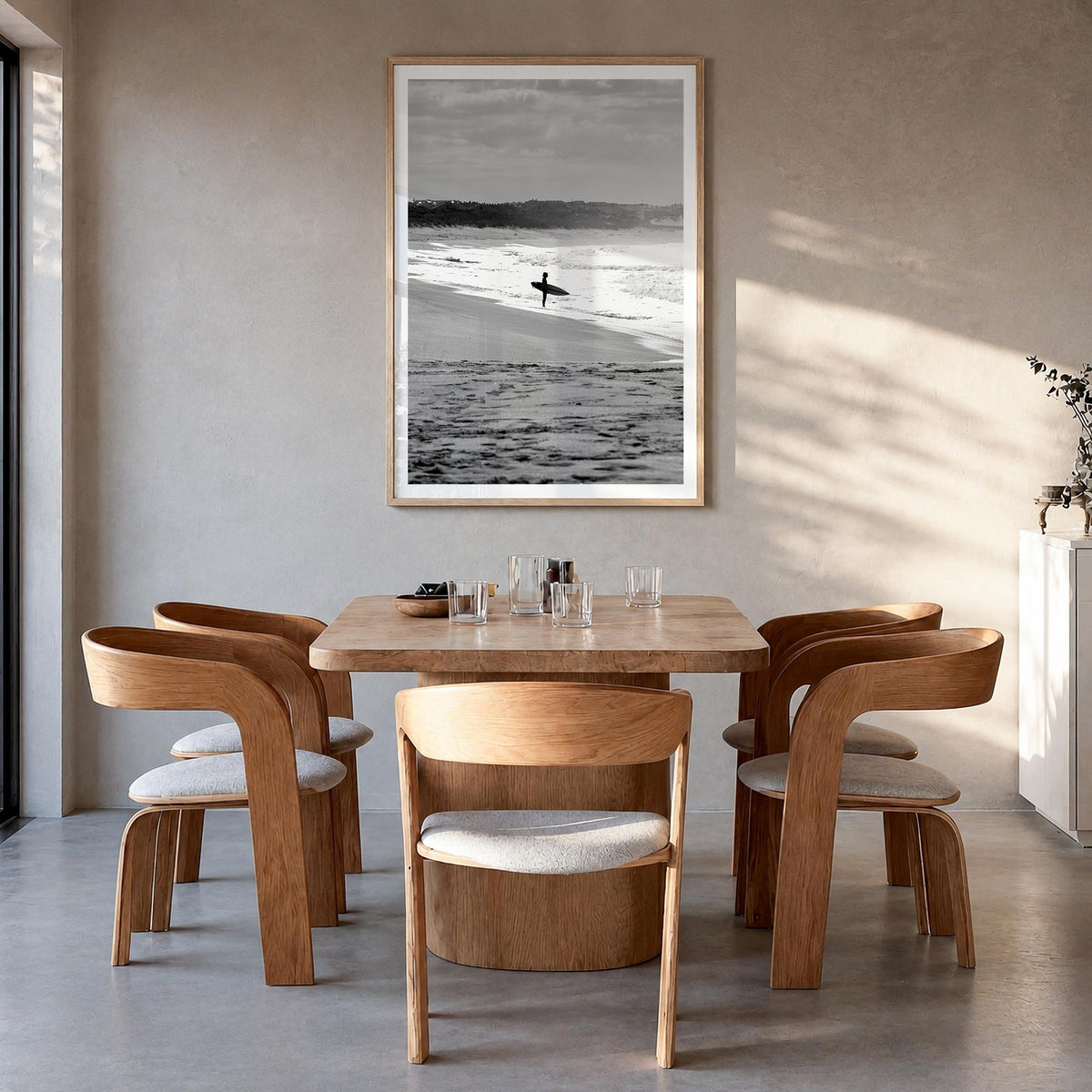 Surfer no. 3 black & white photo poster – vertical wall art in natural wood frame with white border, hanging on wall