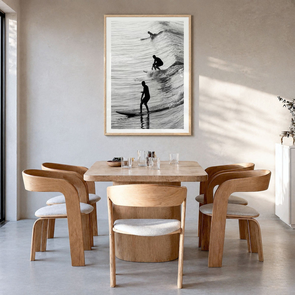 Surfing Photo No 2 Poster in a natural wood frame, hanging in a dining room, white border