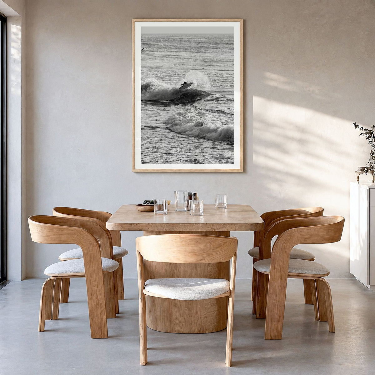 Surfing Photo No 3 Poster in a natural wood frame, hanging in a dining room, white border
