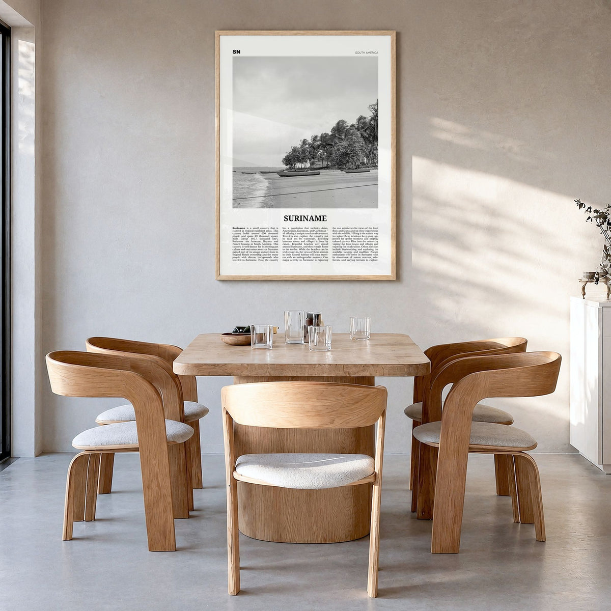 Suriname Newspaper Poster in a natural wood frame, hanging in a dining room