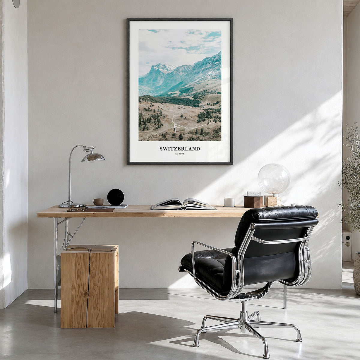 Switzerland Classic Poster in a black wood frame, hanging in a bright home office