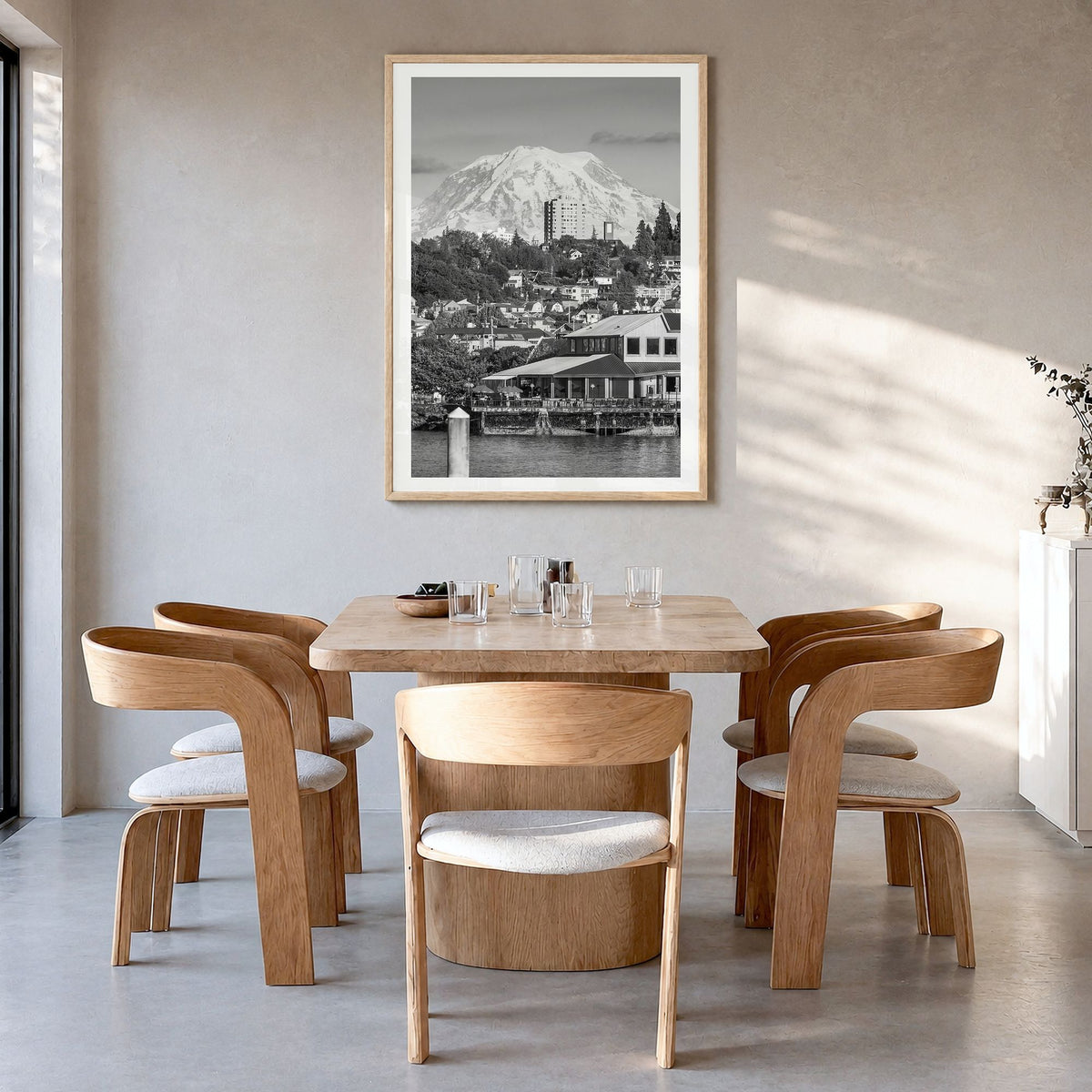 Tacoma Photo Poster in a natural wood frame, hanging in a dining room, white border