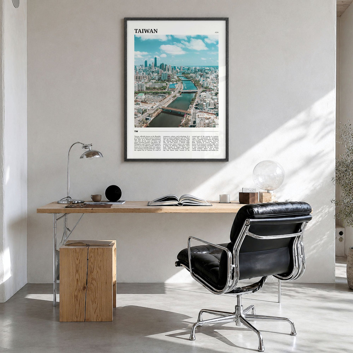 Taiwan Travel Poster in a black wood frame, hanging in a bright home office