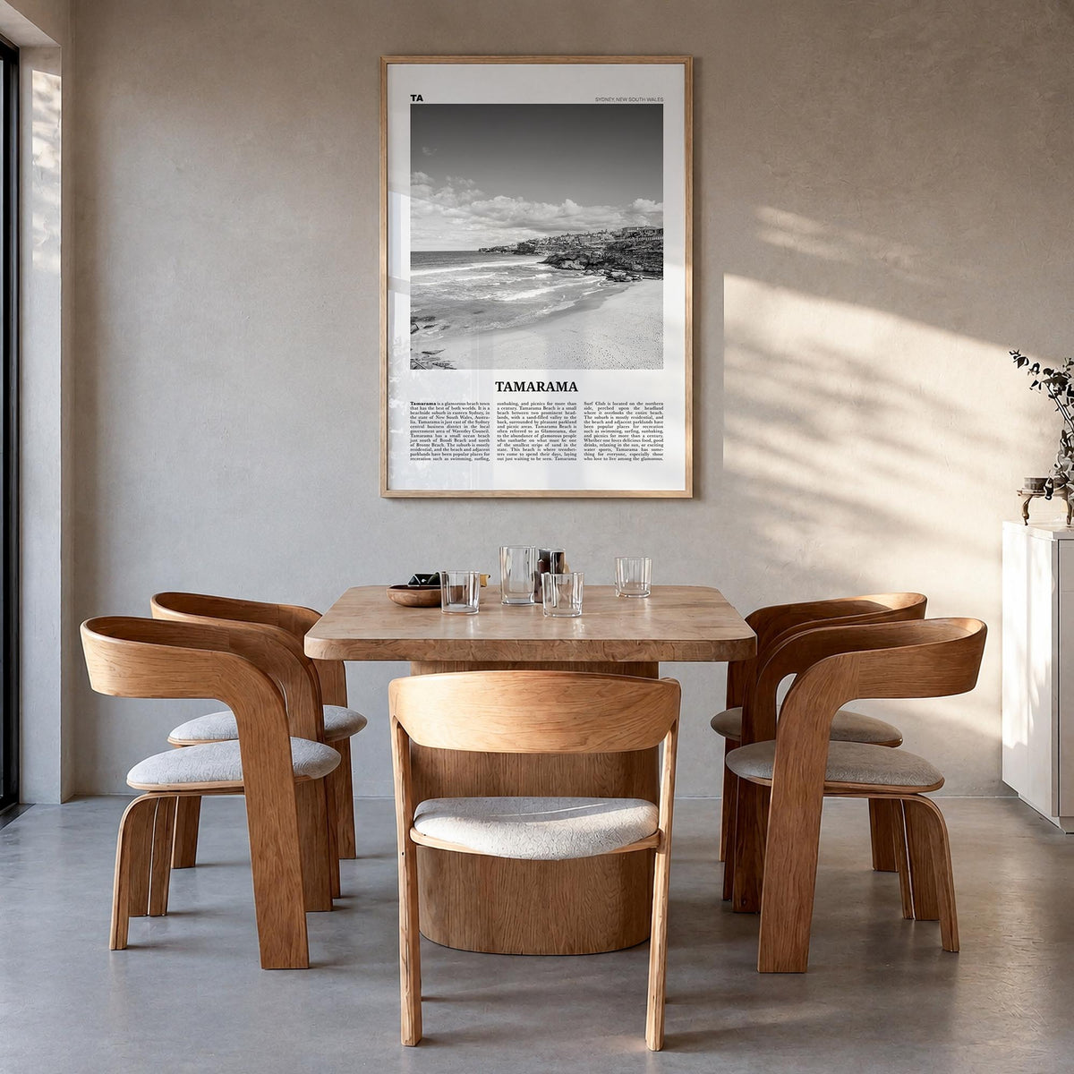 Tamarama black & white newspaper poster of Sydney, New South Wales – vertical wall art in natural wood frame, hanging on wall