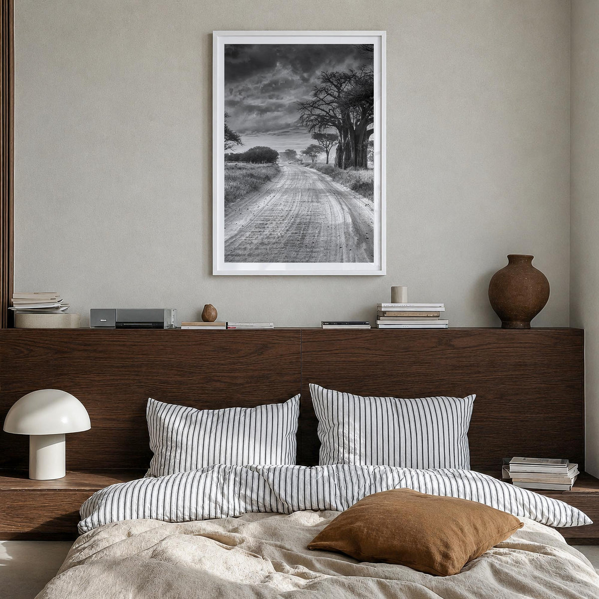Tanzania black & white photo poster of Africa – vertical wall art in white wood frame with white border, hanging on wall