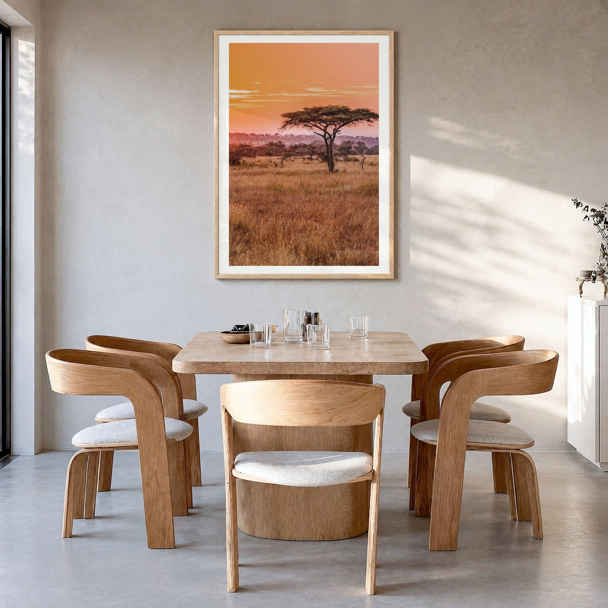 Tanzania Photo Poster in a natural wood frame, hanging in a dining room, white border