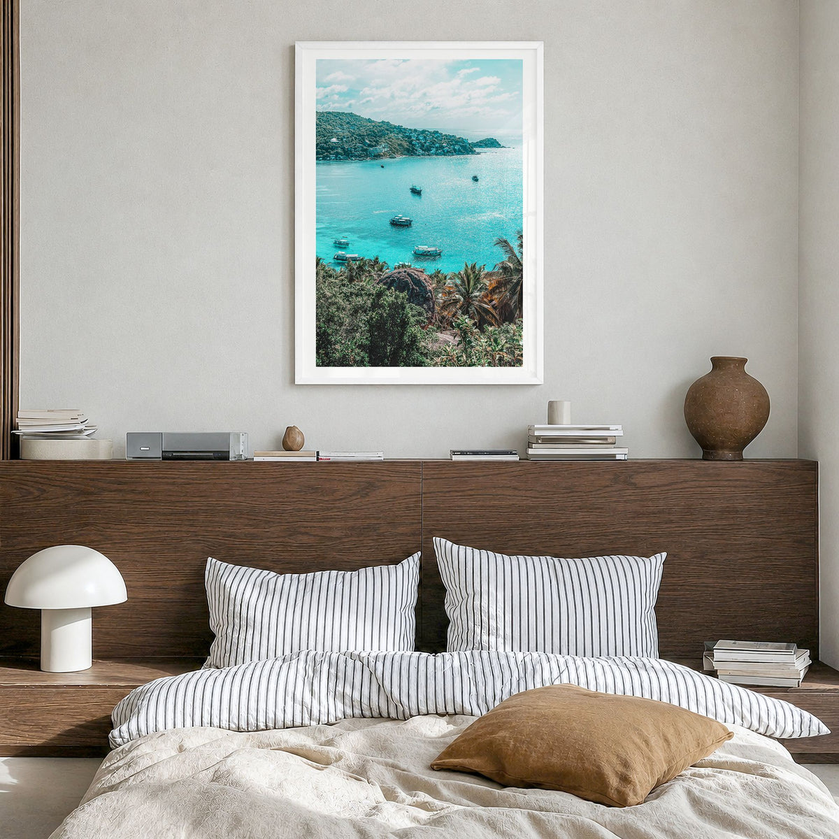 Taos Photo Poster in a white wood frame, hanging in a bedroom, white border