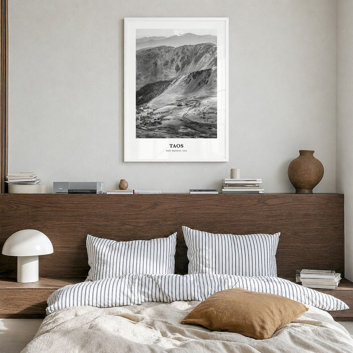 Taos Classic Poster in a white wood frame, hanging in a bedroom
