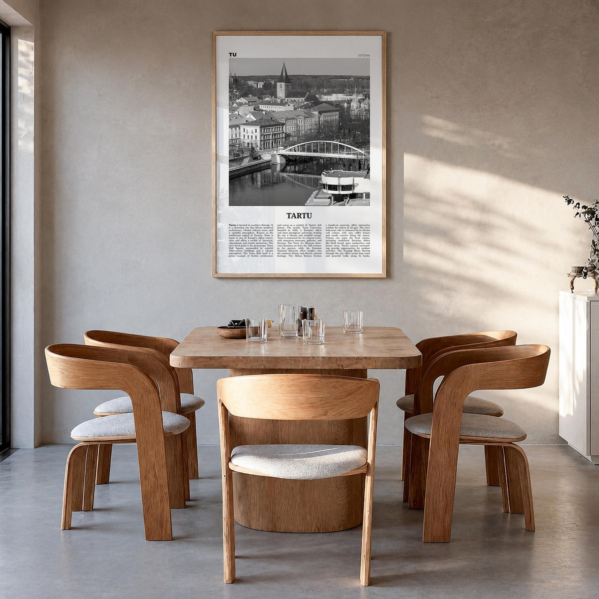 Tartu black & white newspaper poster of Estonia – vertical wall art in natural wood frame, hanging on wall