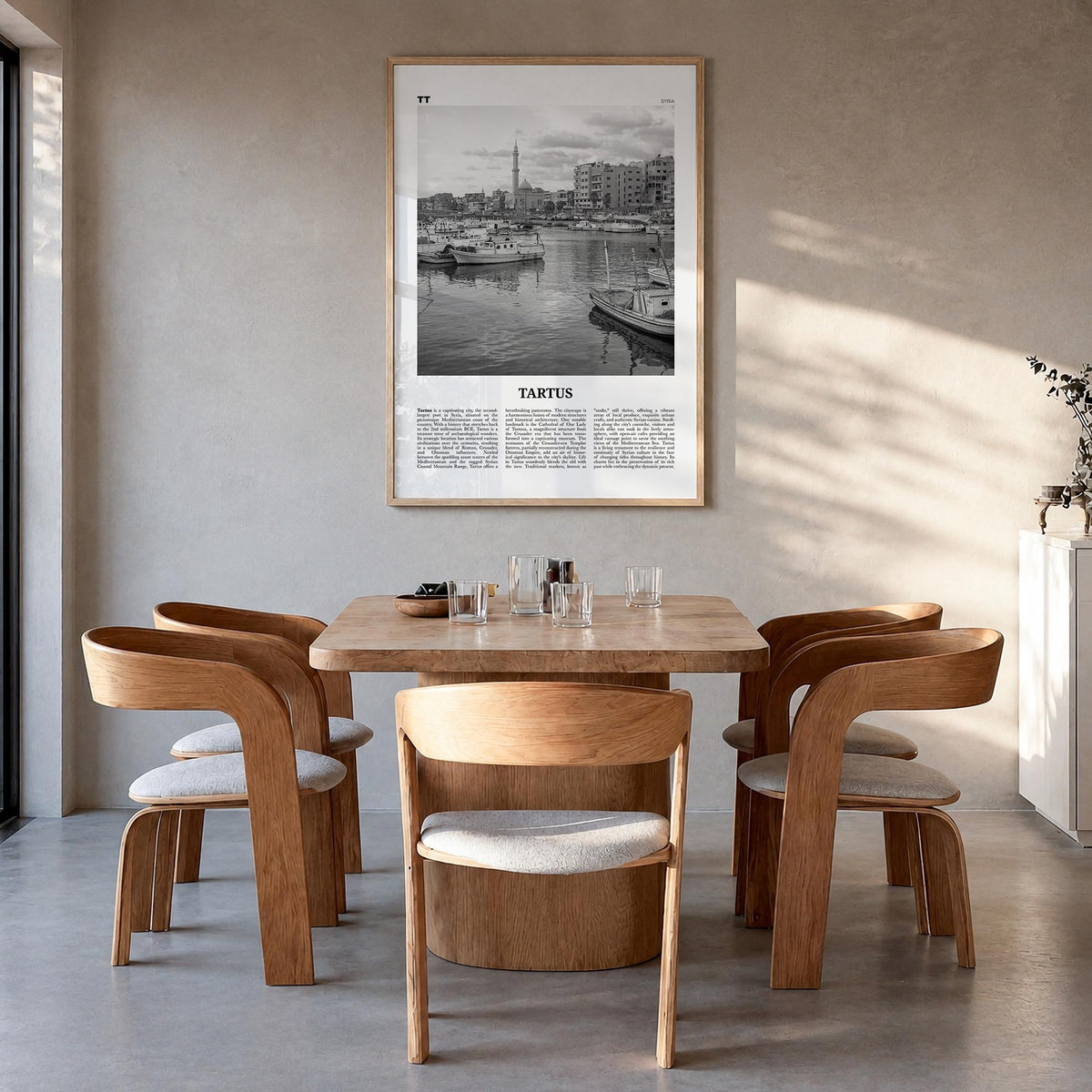 Tartus black & white newspaper poster of Syria – vertical wall art in natural wood frame, hanging on wall
