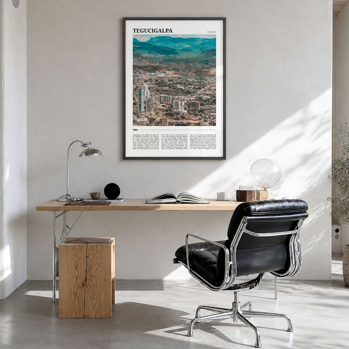 Tegucigalpa Travel Poster in a black wood frame, hanging in a bright home office