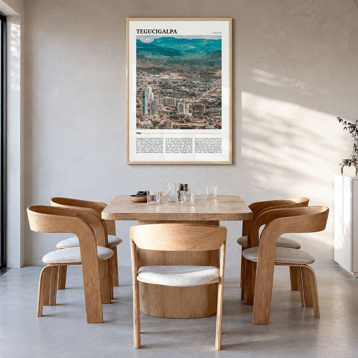 Tegucigalpa Travel Poster in a natural wood frame, hanging in a dining room