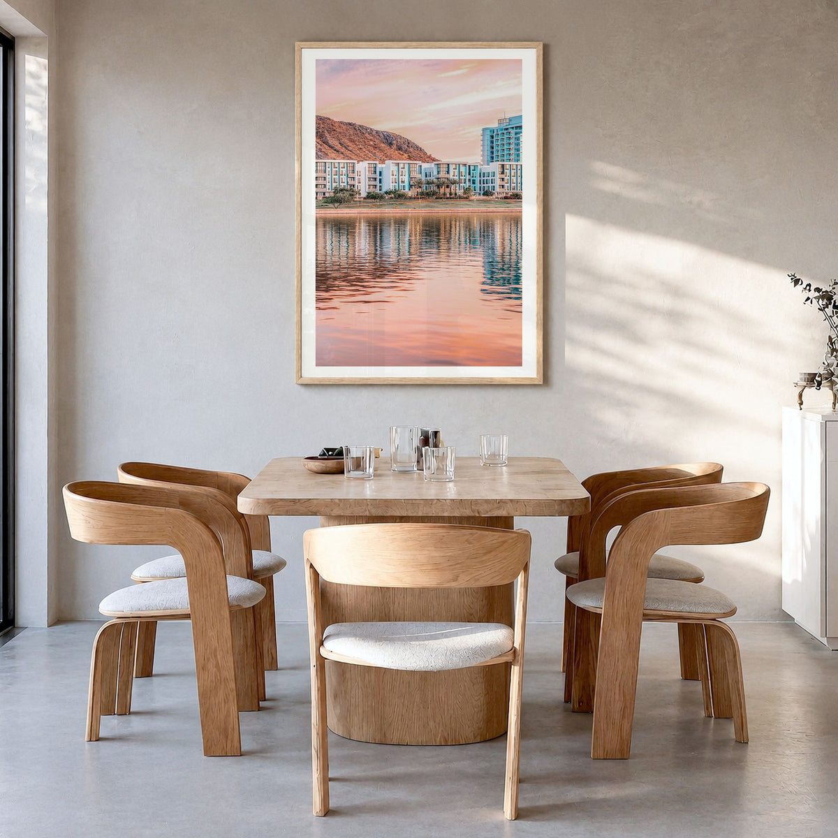 Tempe Photo Poster in a natural wood frame, hanging in a dining room, white border