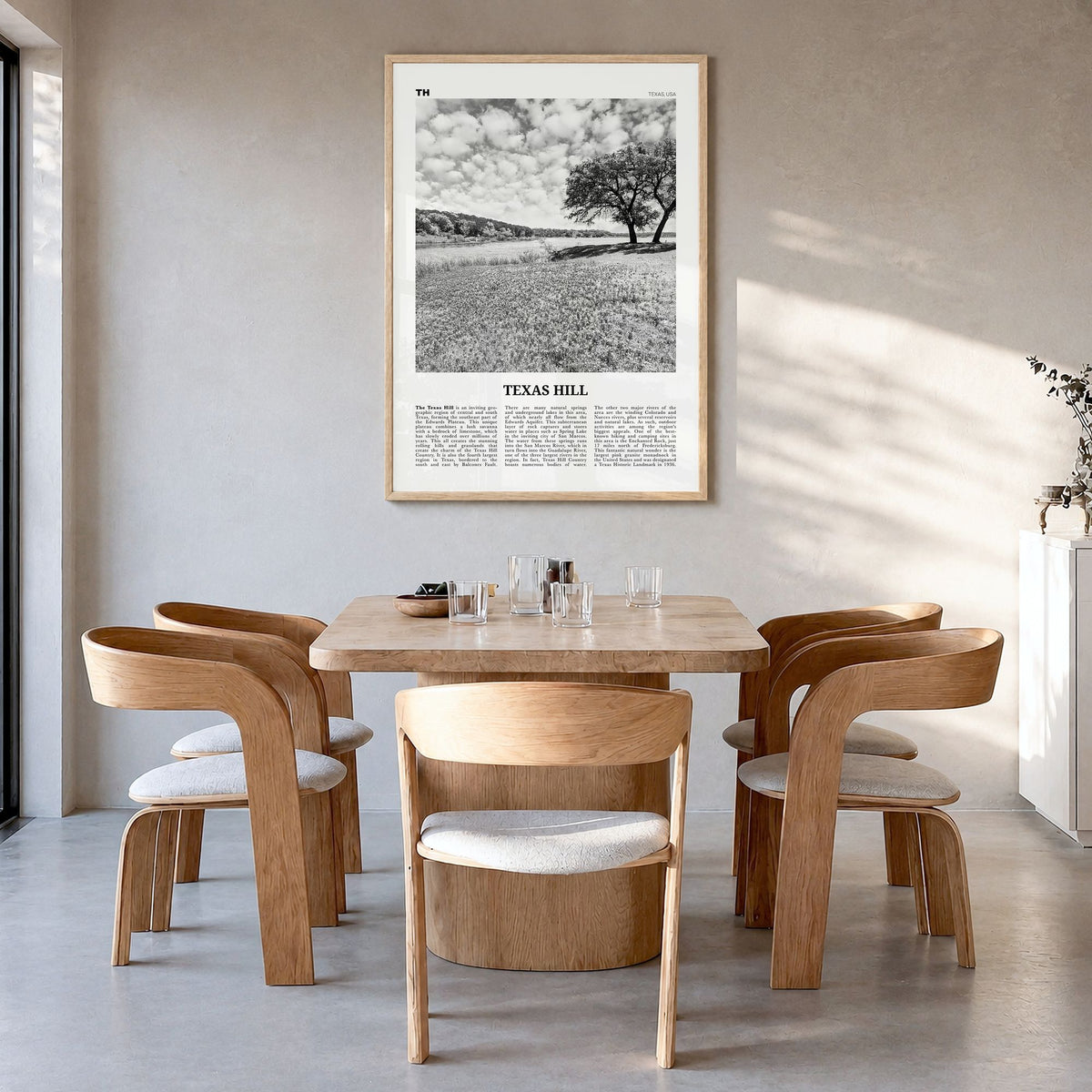 Texas Hill Country Newspaper Poster in a natural wood frame, hanging in a dining room