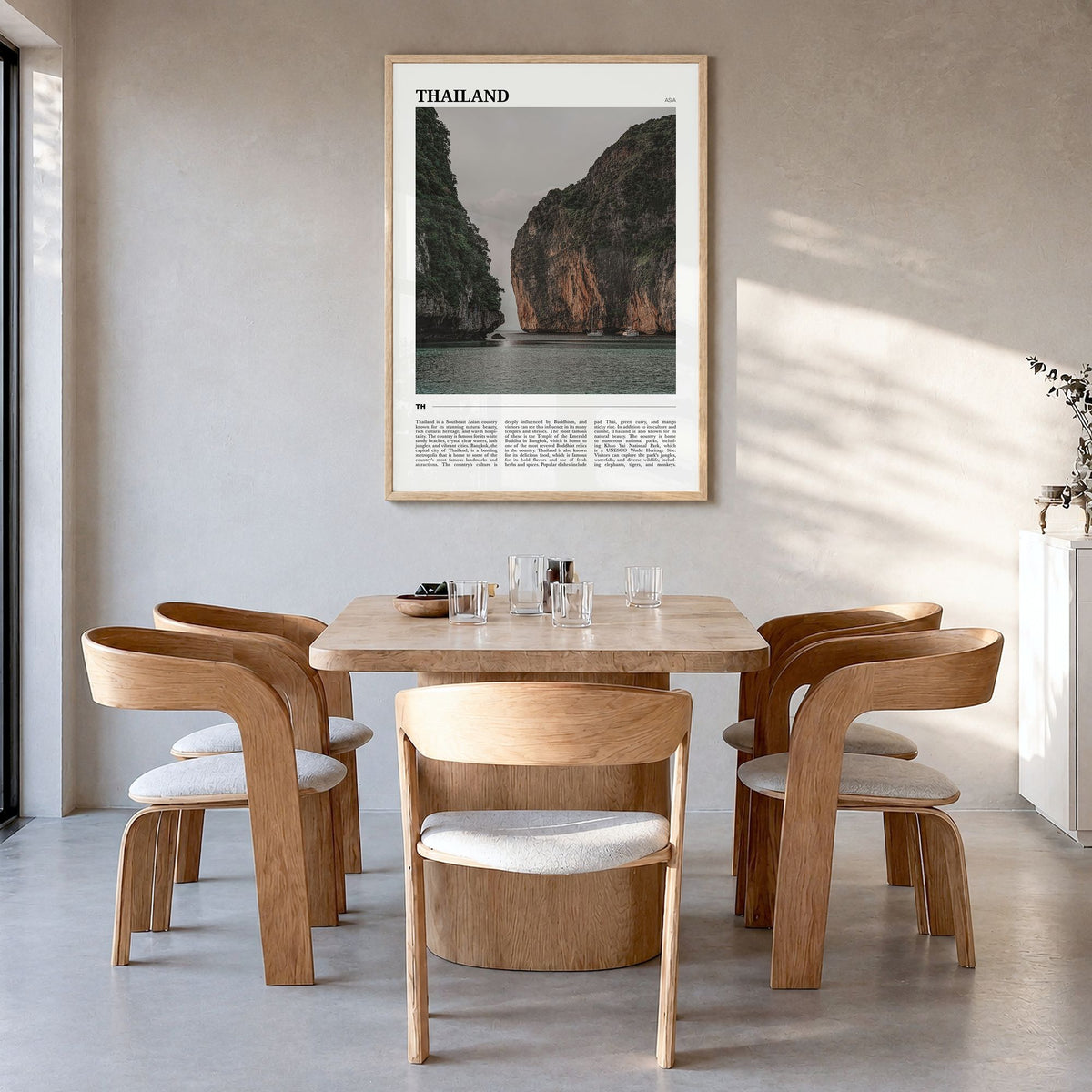Thailand Travel Poster in a natural wood frame, hanging in a dining room
