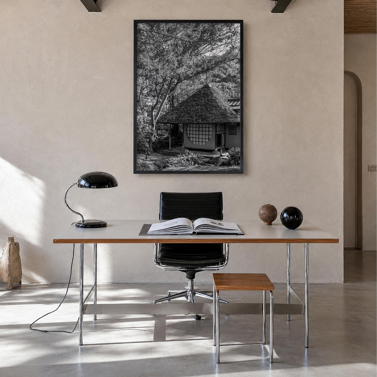 Thatched Hut no. 2 black & white photo poster – vertical wall art in black wood frame, hanging on wall