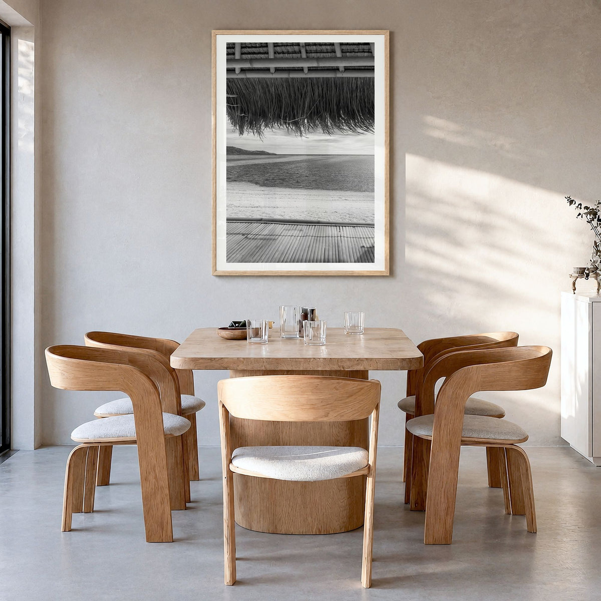 Thatched Hut Photo No 1 Poster in a natural wood frame, hanging in a dining room, white border