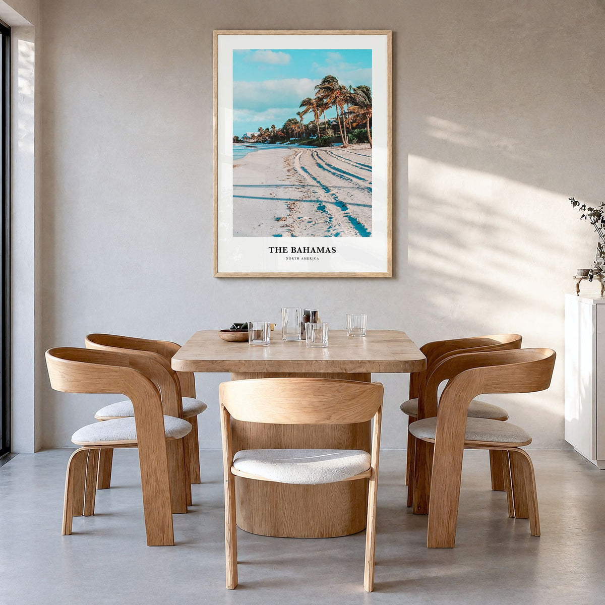 The Bahamas Classic Poster in a natural wood frame, hanging in a dining room
