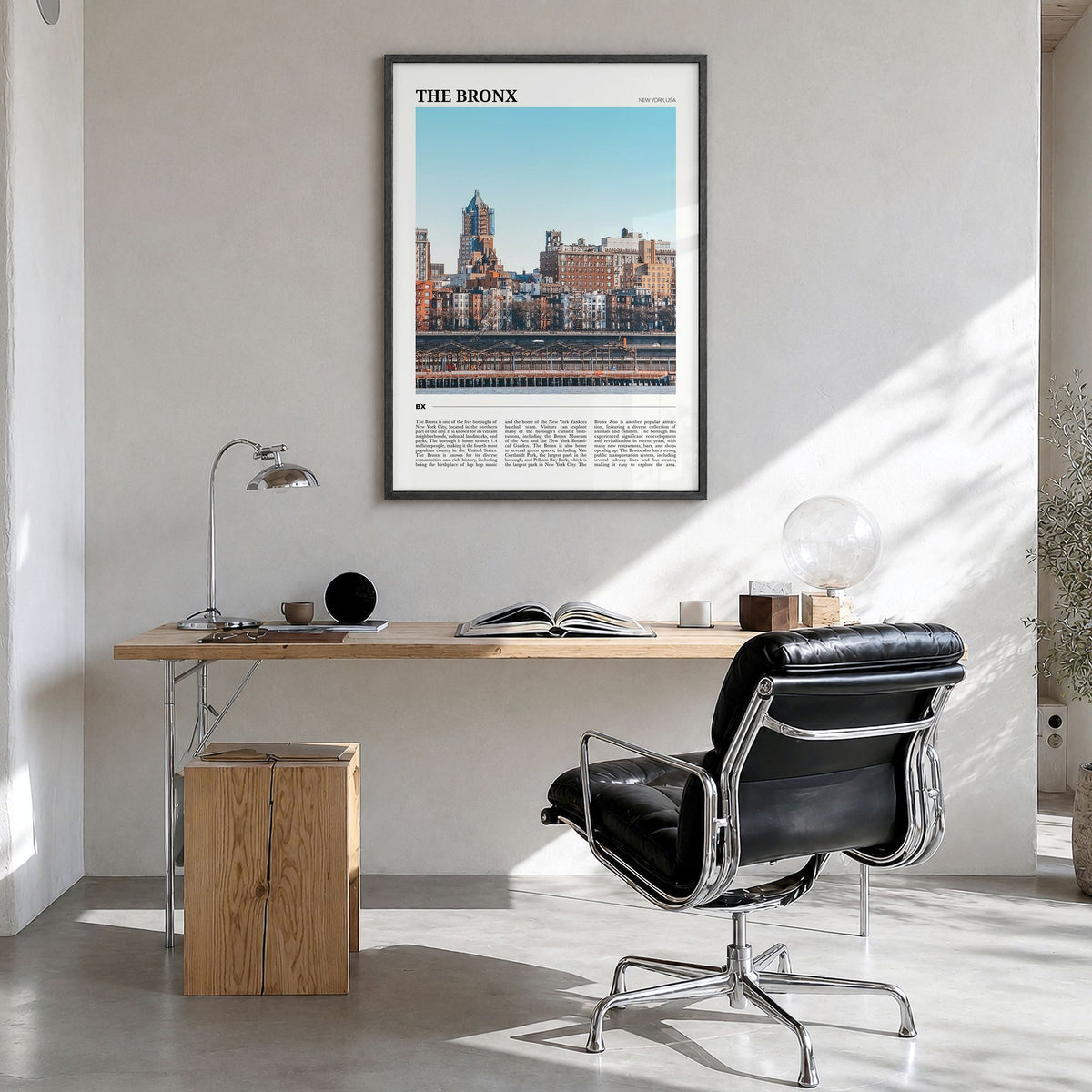 The Bronx Travel No 1 Poster in a black wood frame, hanging in a bright home office