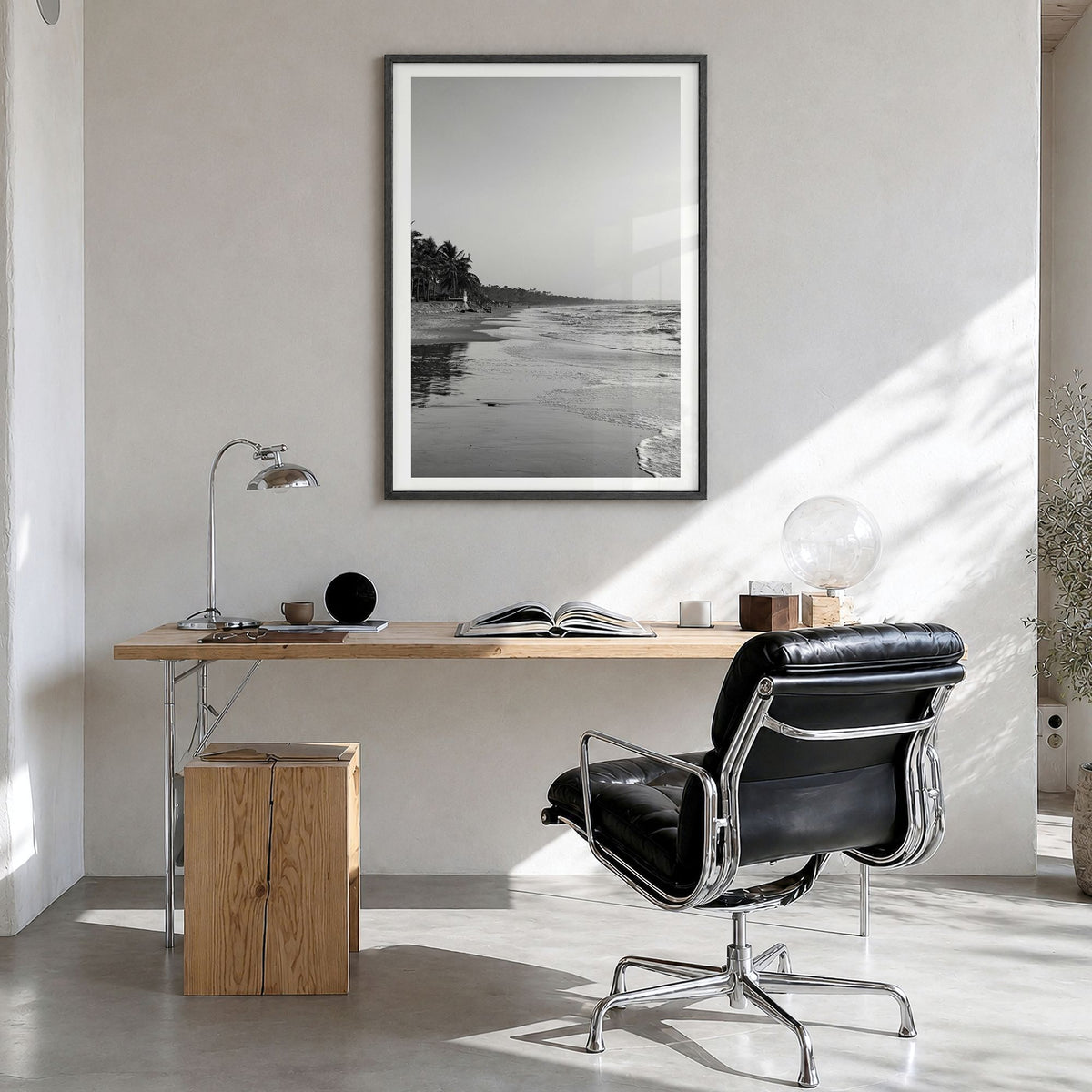 The Gambia Photo Poster in a black wood frame, hanging in a bright home office, white border
