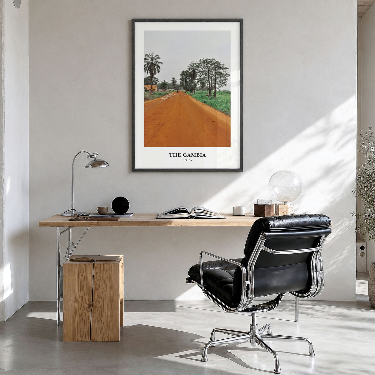 The Gambia Classic Poster in a black wood frame, hanging in a bright home office