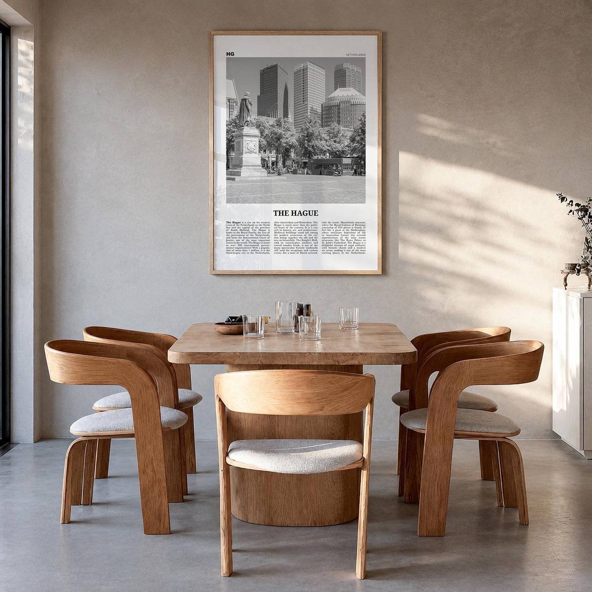 The Hague black & white newspaper poster of Netherlands – vertical wall art in natural wood frame, hanging on wall