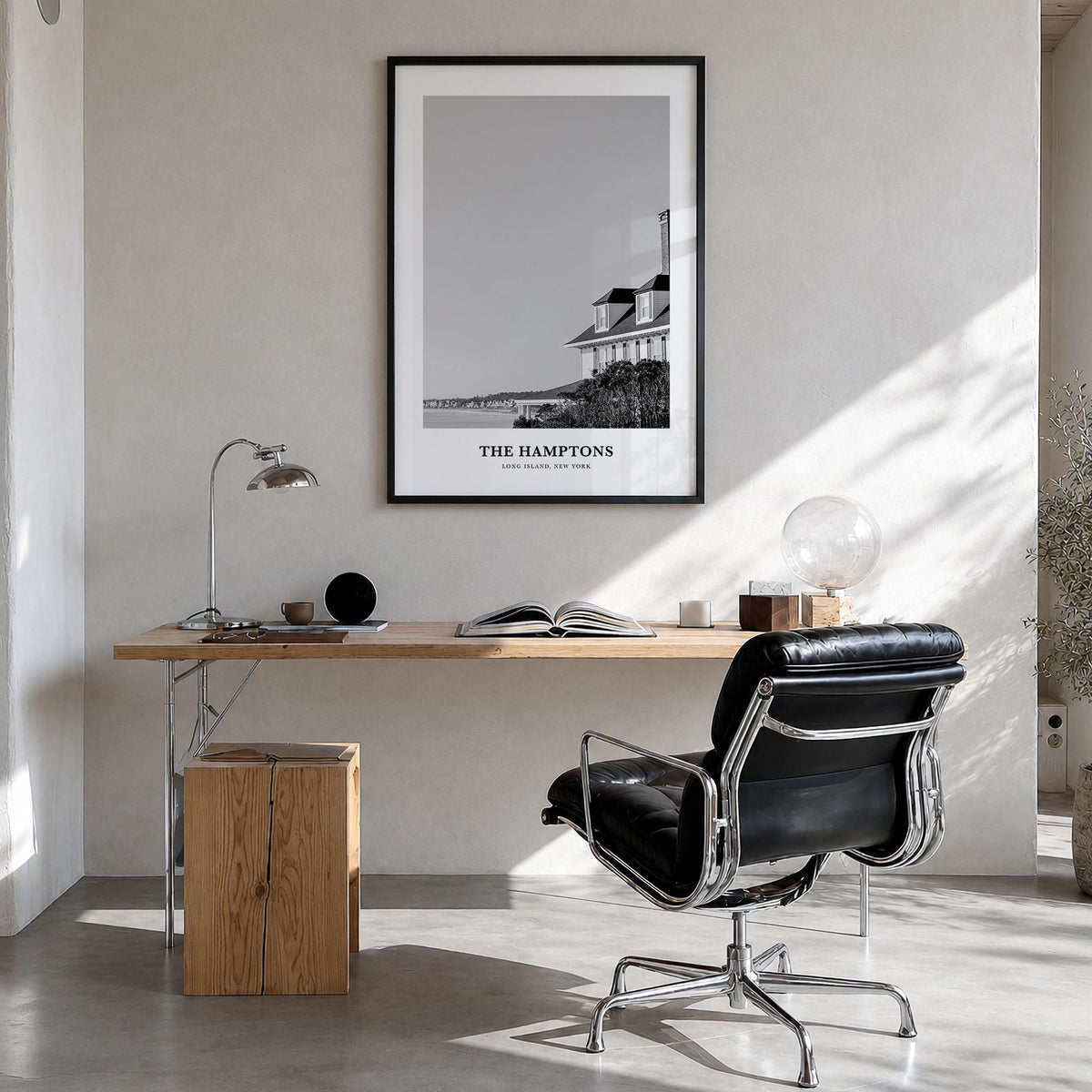 The Hamptons black & white classic poster of Long Island, New York – vertical wall art in black wood frame, hanging on wall