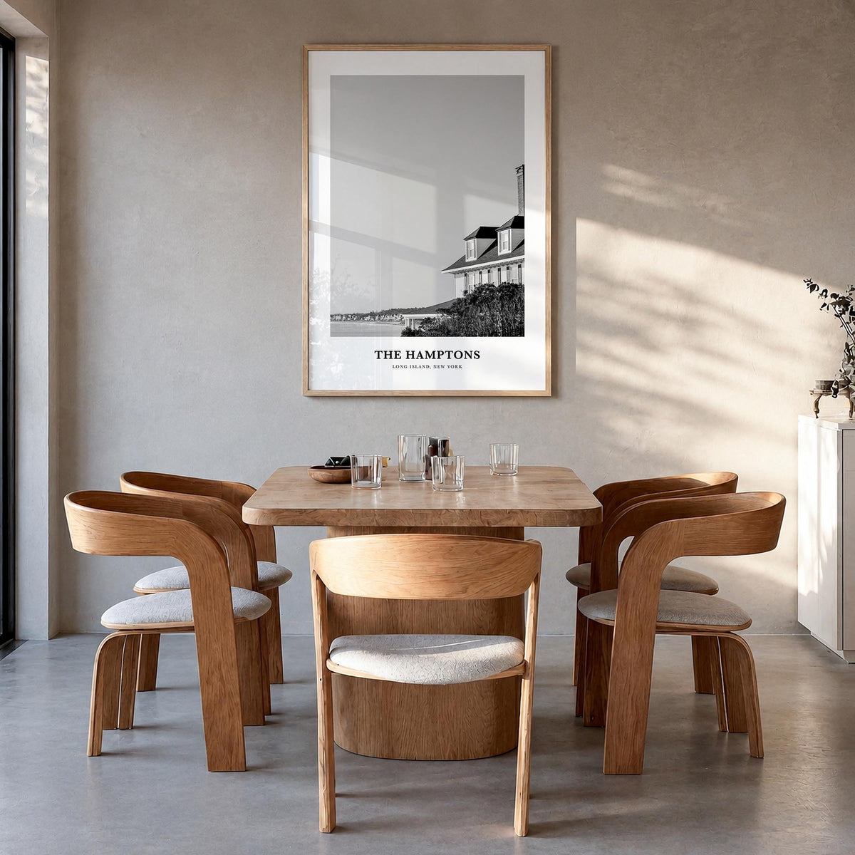The Hamptons black & white classic poster of Long Island, New York – vertical wall art in natural wood frame, hanging on wall
