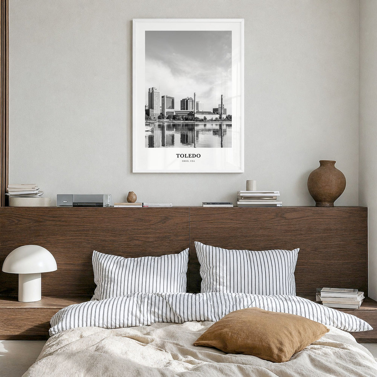 Toledo, Ohio Classic Poster in a white wood frame, hanging in a bedroom