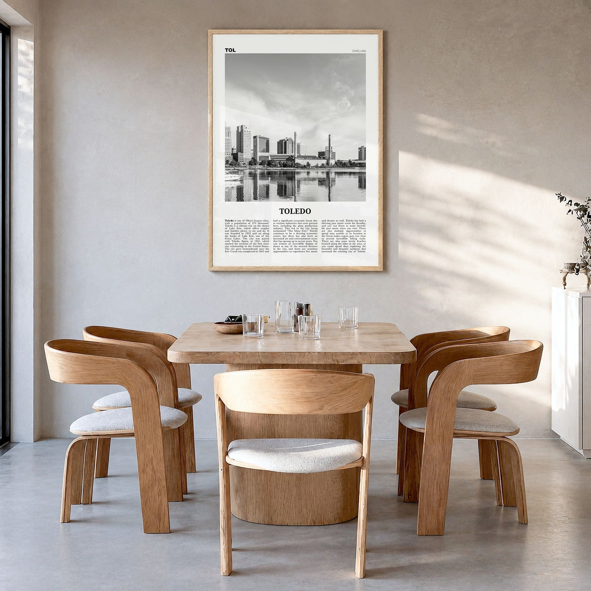 Toledo, Ohio Newspaper Poster in a natural wood frame, hanging in a dining room