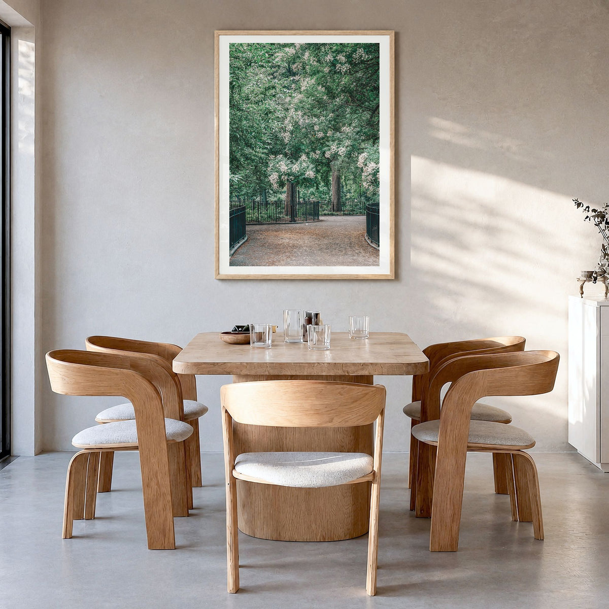 Tompkins Square Park Photo Poster in a natural wood frame, hanging in a dining room, white border