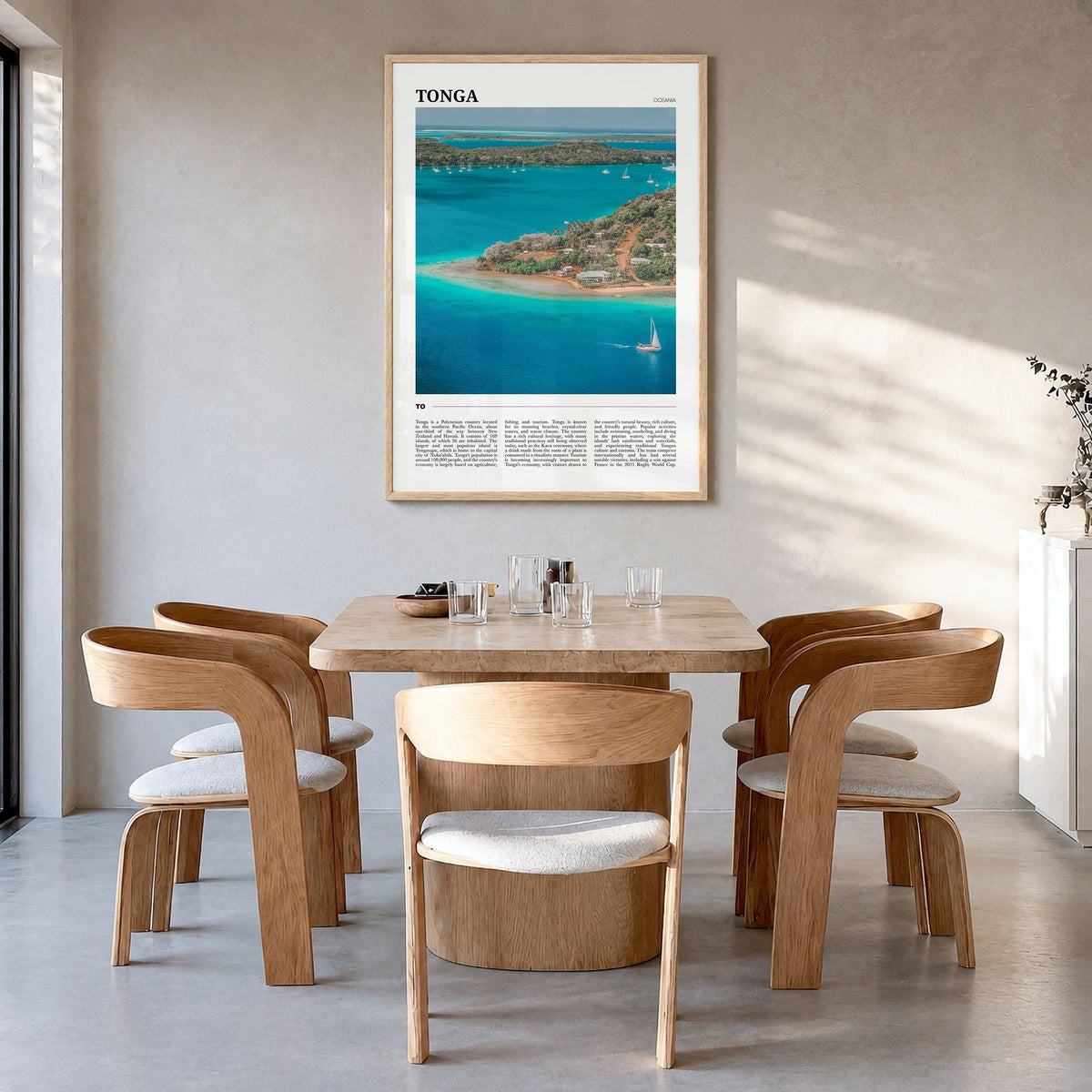 Tonga Travel Poster in a natural wood frame, hanging in a dining room