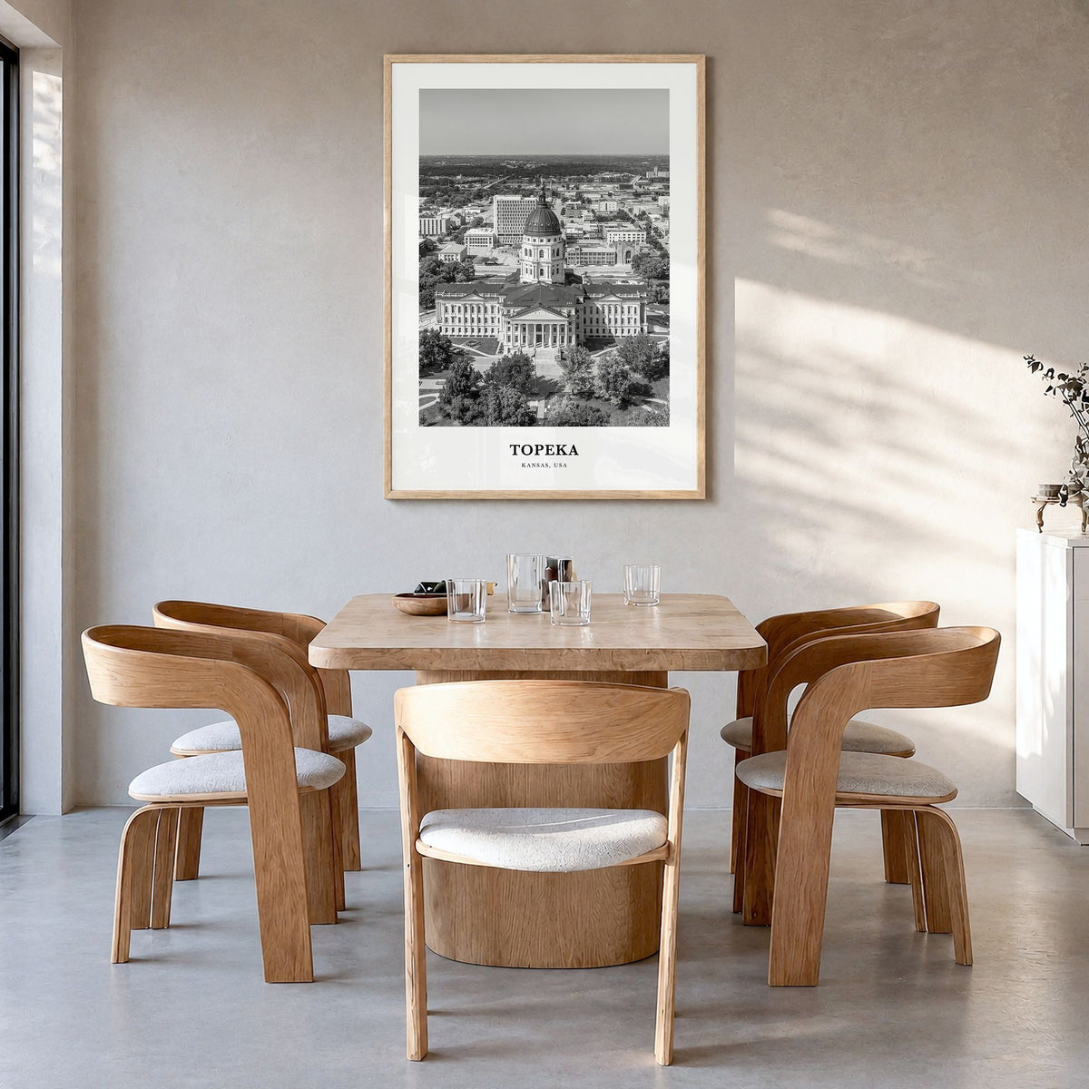 Topeka Classic Poster in a natural wood frame, hanging in a dining room