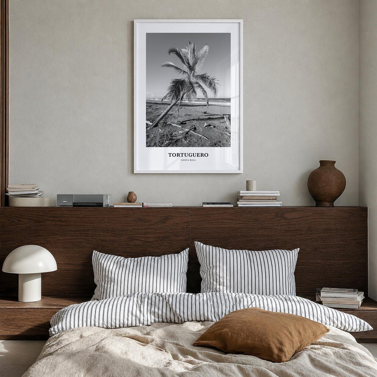 Tortuguero black & white classic poster of Costa Rica – vertical wall art in white wood frame, hanging on wall